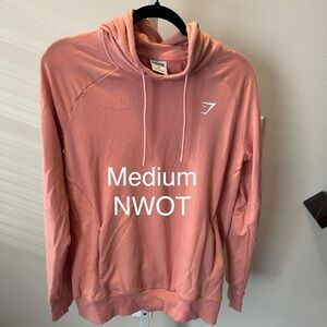 Gymshark medium light pink hoodie sweatshirt nwot 
Thin stretchy material